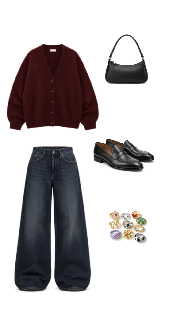 Burgundy cardigan styled with dark wide-leg jeans, black loafers, a shoulder bag, and colourful statement rings.
